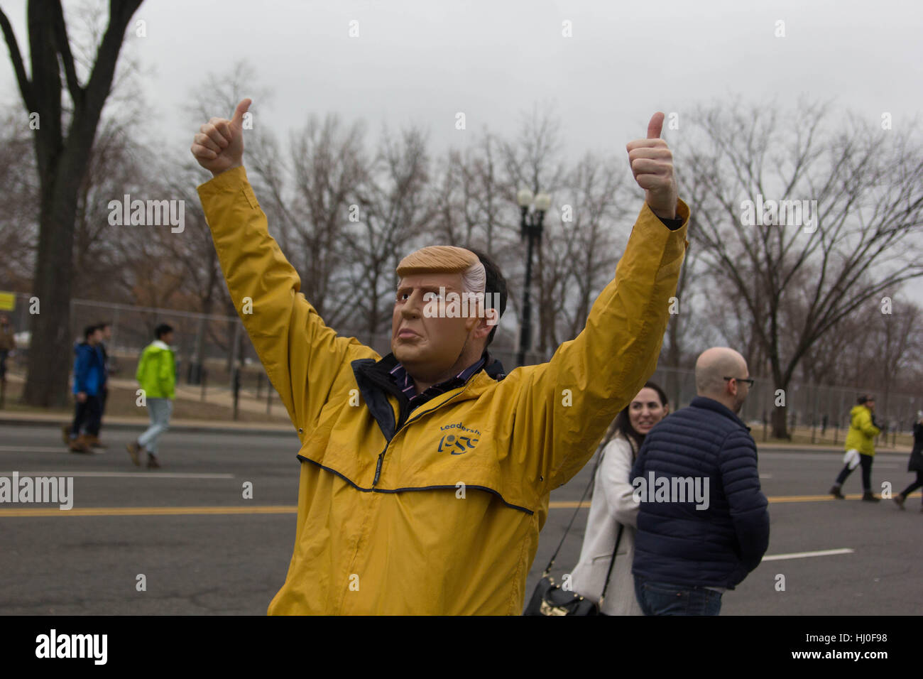 Washington DC, USA. 20th January, 2017. A man in a Donald Trump mask engages with protestors on the streets of Washington, DC, Friday, January 20, 2017. Credit: Michael Candelori/Alamy Live News Stock Photo