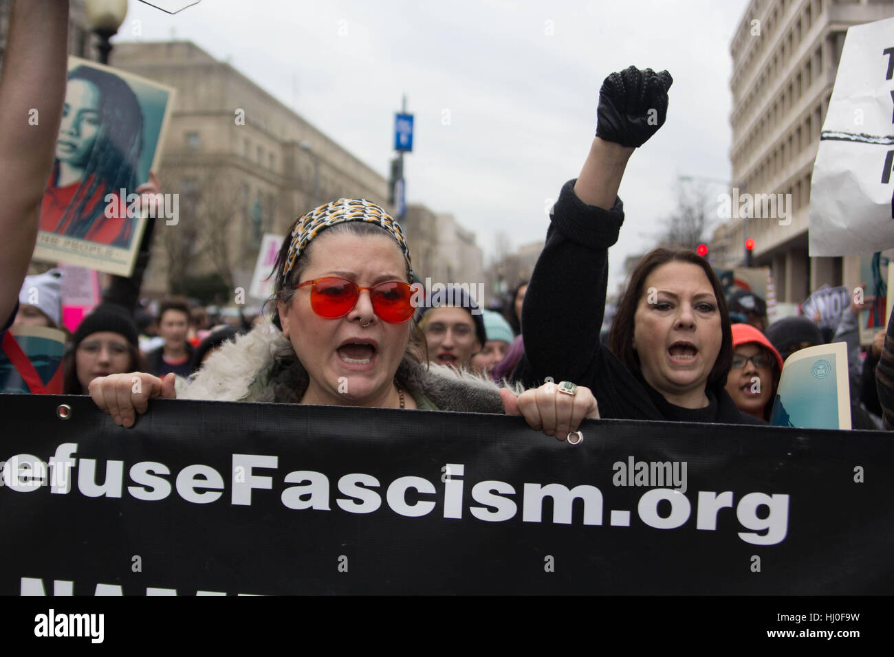 Washington DC, USA. 20th January, 2017. Protestors march voicing concerns about newly inaugurated President Donald Trump on the streets of Washington, DC, Friday, January 20, 2017. Credit: Michael Candelori/Alamy Live News Stock Photo