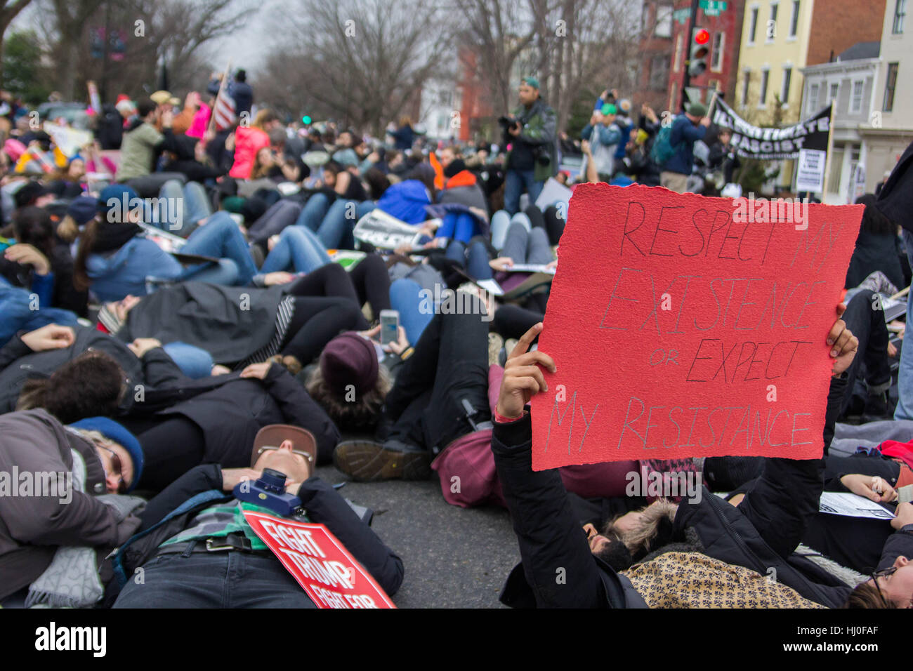 Washington DC, USA. 20th January, 2017. Protestors march voicing concerns about newly inaugurated President Donald Trump on the streets of Washington, DC, Friday, January 20, 2017. Credit: Michael Candelori/Alamy Live News Stock Photo
