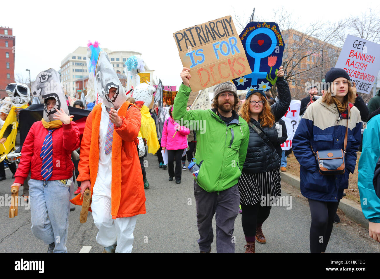 Washington, DC, USA. 20th January, 2017. Demonstrations on inauguration day.  Costumed performers, and people in the 'Festival of Resistance' march. The people hold a sign saying, 'Patriarchy is for Dicks', 'Feminism is for Everybody'. January 20, 2017. Stock Photo