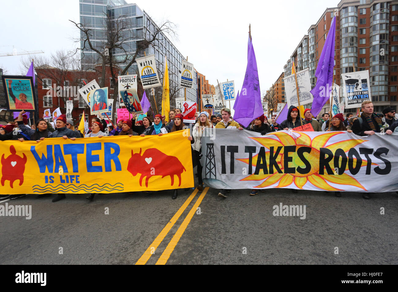 Washington, DC, USA. 20th January, 2017. Demonstrations on inauguration day.  Banners at the head of the women-led, climate justice march 'Festival of Resistance'. January 20, 2017. Stock Photo