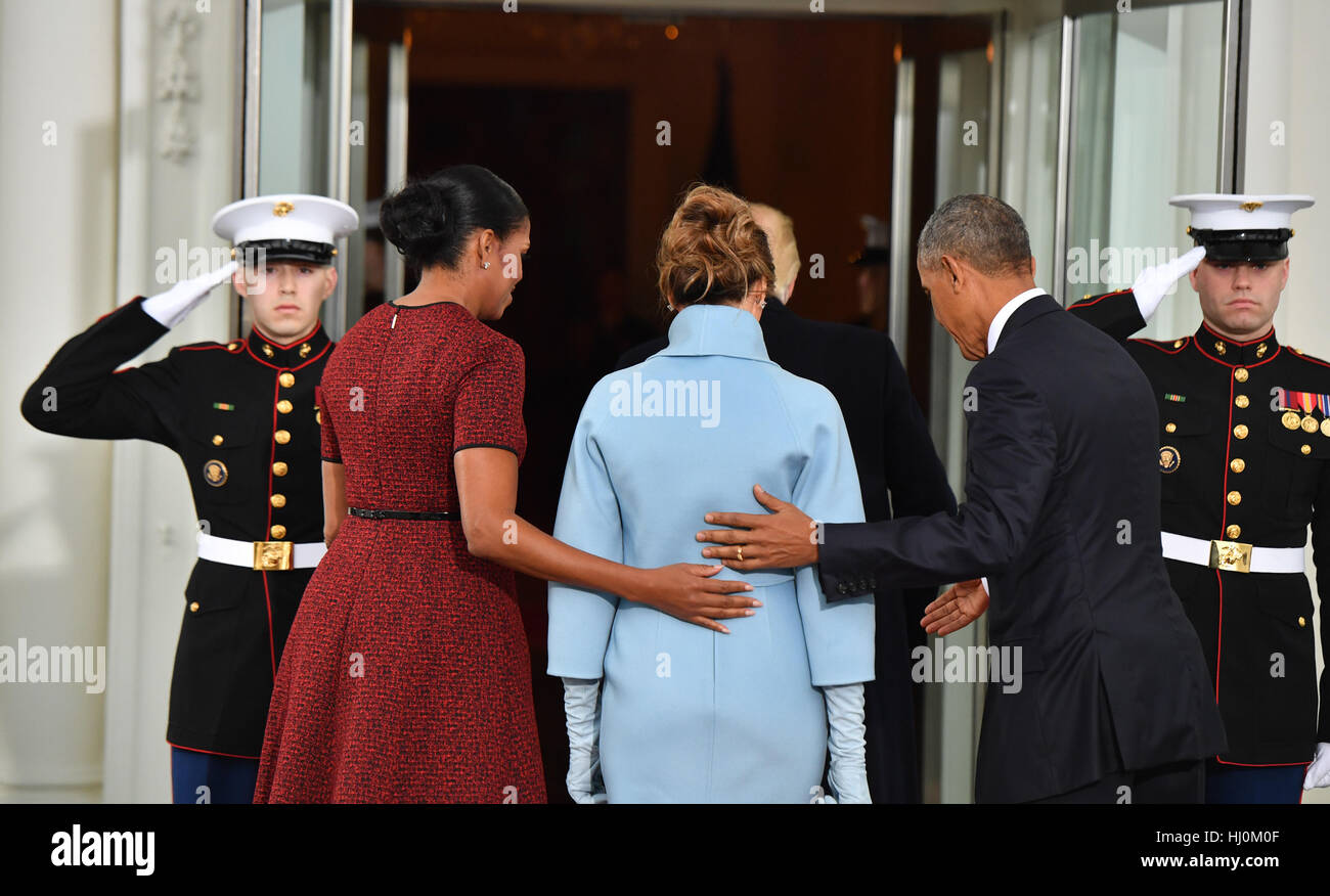 President Barack Obama (R) and Michelle Obama escort President-elect Donald  Trump and wife Melania into the White House for tea before the inauguration  on January 20, 2017 in Washington, DC Trump becomes