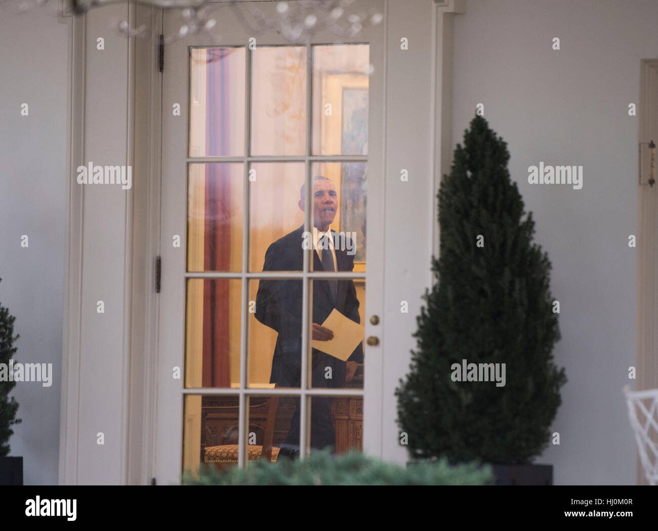 President Barack Obama is seen in the Oval Office for the last time as ...