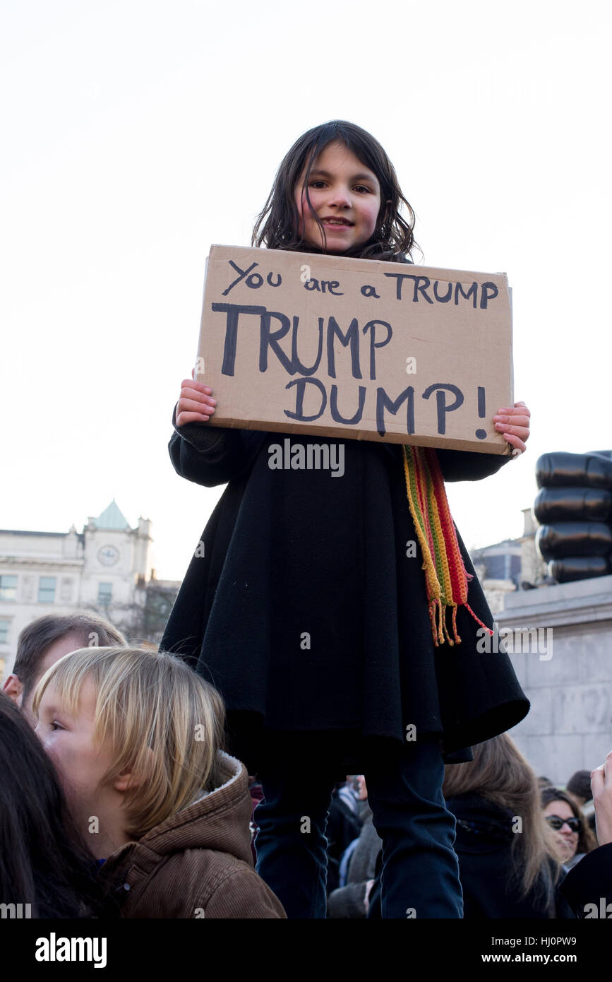 London, UK - 21 January 2017. Little girl holding sign against Trump. Thousands of protesters gathered in Trafalgar Square to attend Women's March against Donald Trump calling for human rights and equality. Stock Photo