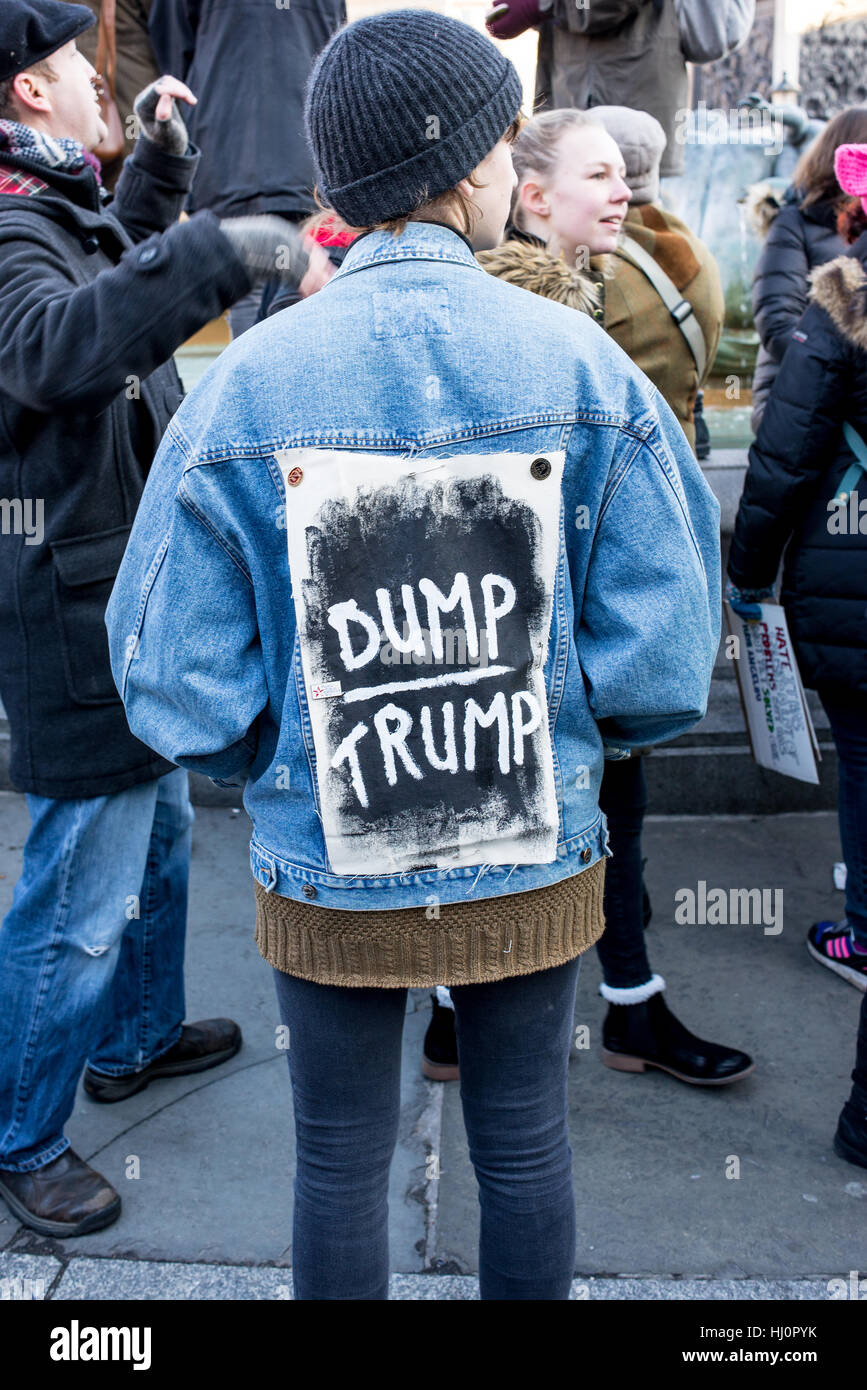 London, UK - 21 January 2017. Protester wearing sign against Trump on the jacket.  Thousands of protesters gathered in Trafalgar Square to attend Women's March against Donald Trump calling for human rights and equality. Stock Photo