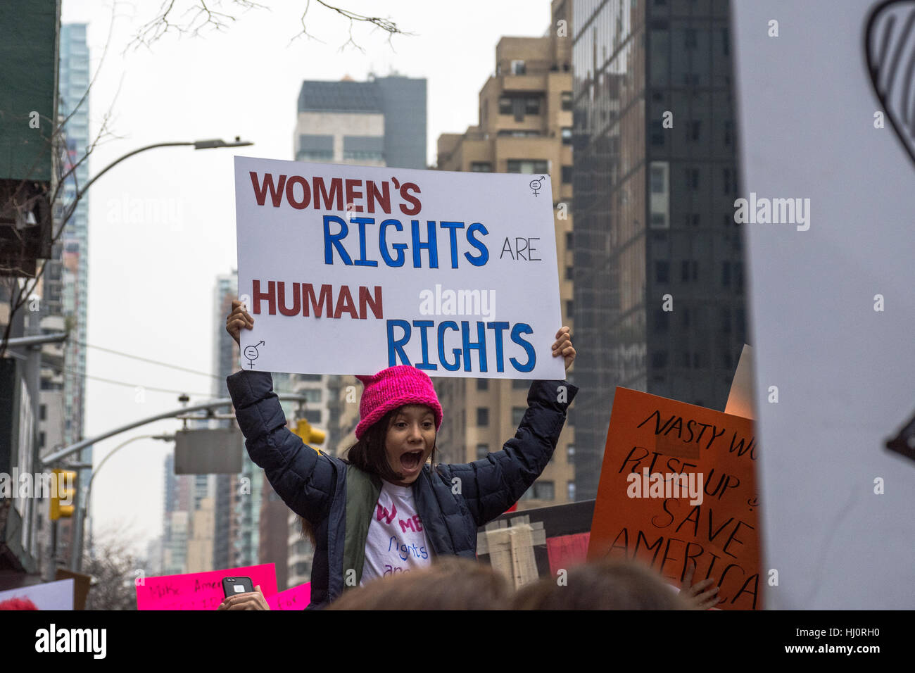 New York, NY, USA. 21st January, 2017. Women's March on NYC. A girl carries a sign during the protest. Credit: Matthew Cherchio/Alamy Live News Stock Photo