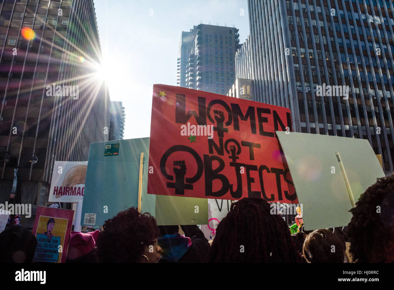 New York, NY, USA. 21st January 2017. Women's March on NYC.  A protester carries a sign that says 'Women, Not Objects' during the march. Credit: Matthew Cherchio/Alamy Live News Stock Photo