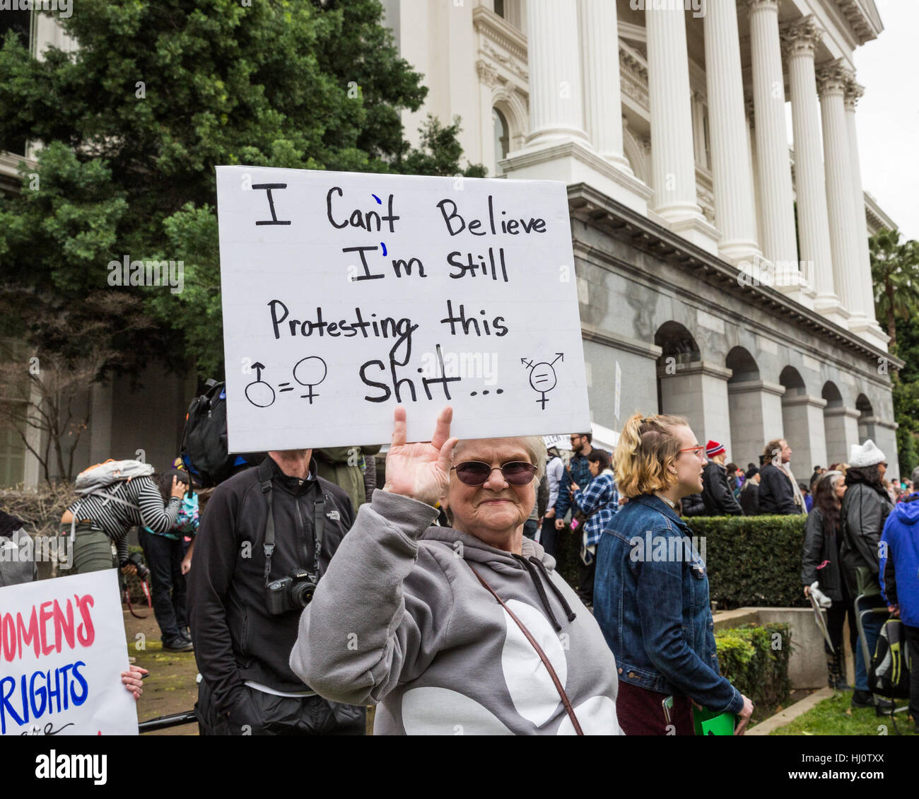 Sacramento, California, USA. 21st Jan, 2017. January 21, 2017.LINDA LANE, of Nevada City, holds her daughter's handmade sign in front of the California State Capitol during the Women's March in Sacramento, California Credit: Tracy Barbutes/ZUMA Wire/Alamy Live News Stock Photo