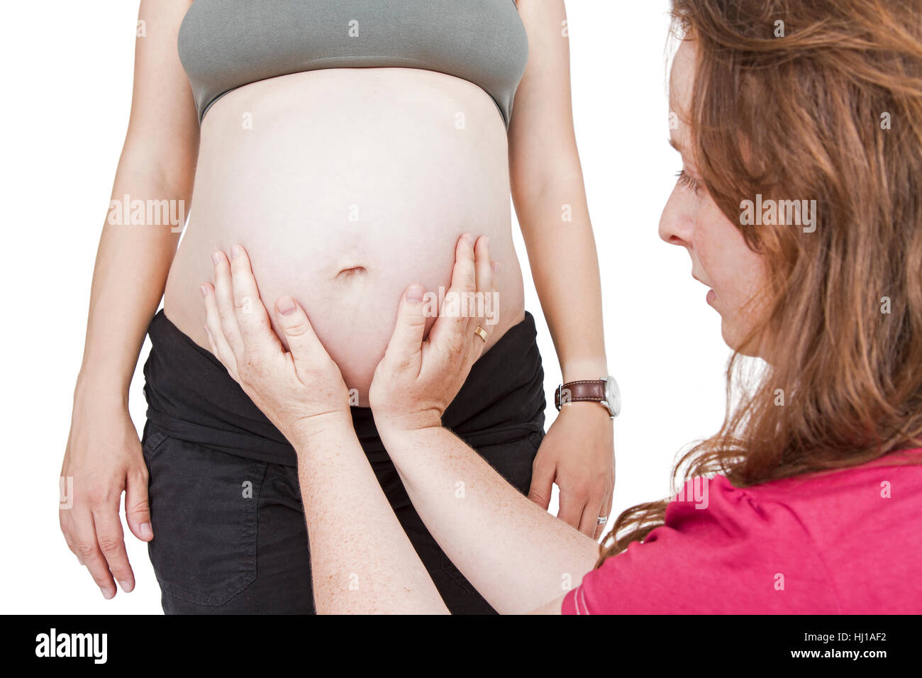 midwife fingering at human belly Stock Photo