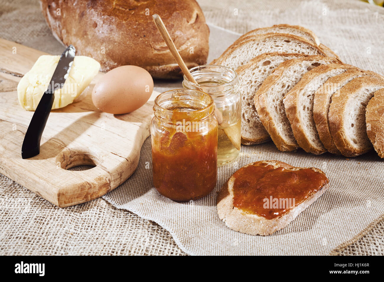 Breakfast With Bread Butter Honey Jam And Egg On The Linen Cloth Stock Photo Alamy
