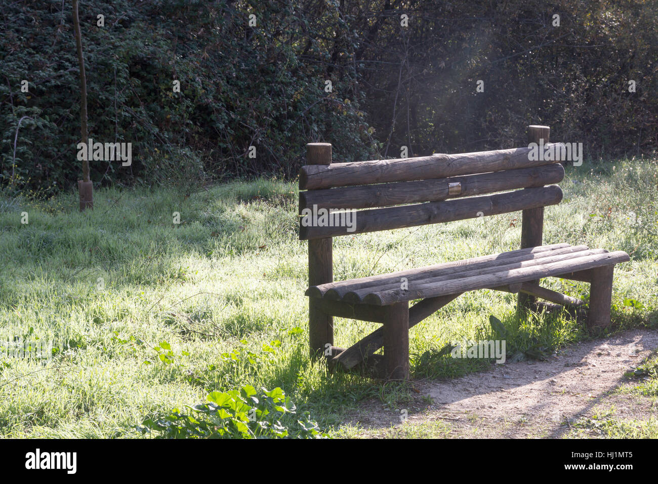 Wooden seat in a park Stock Photo