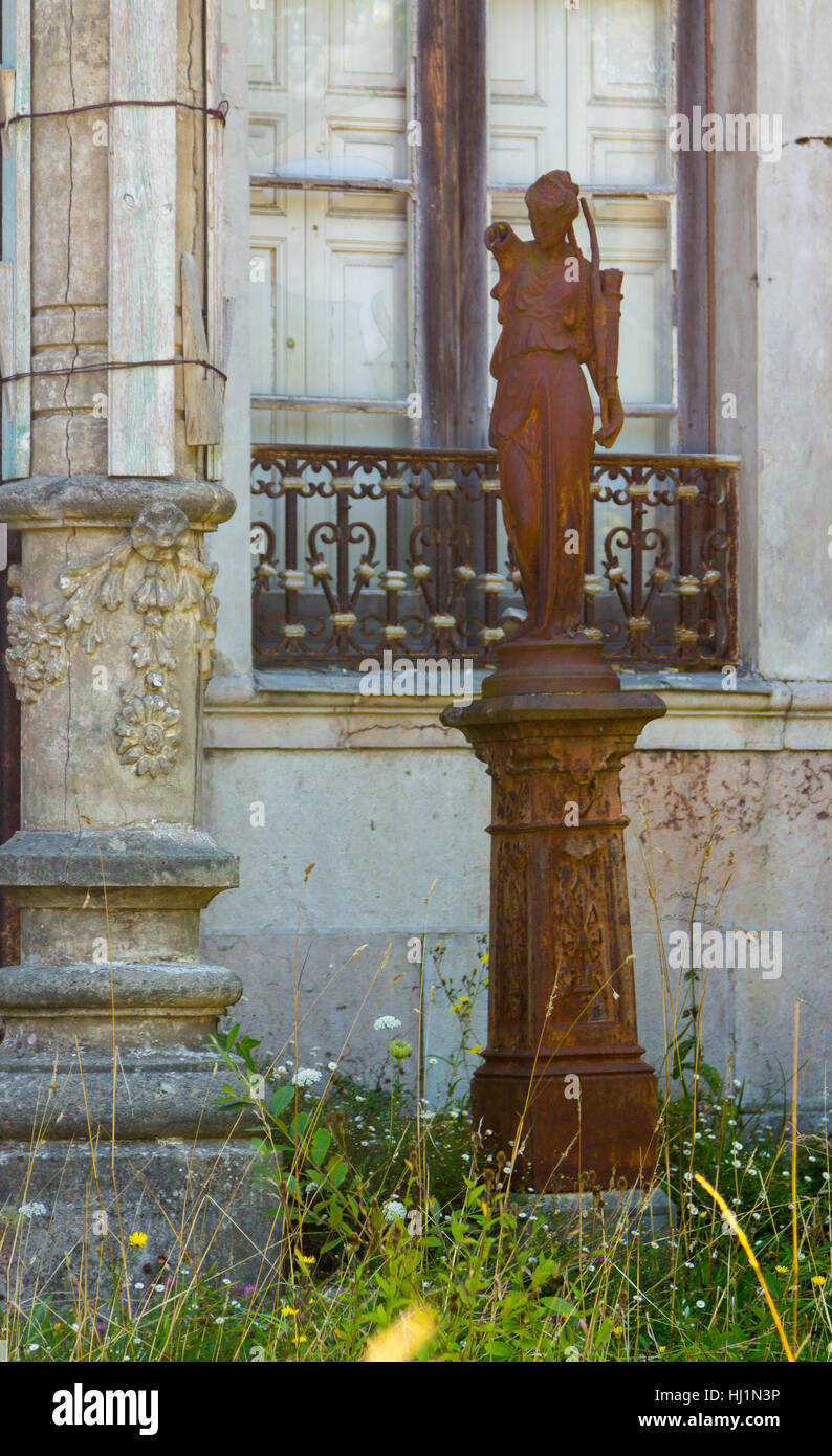 Rusty old statue of a woman Stock Photo