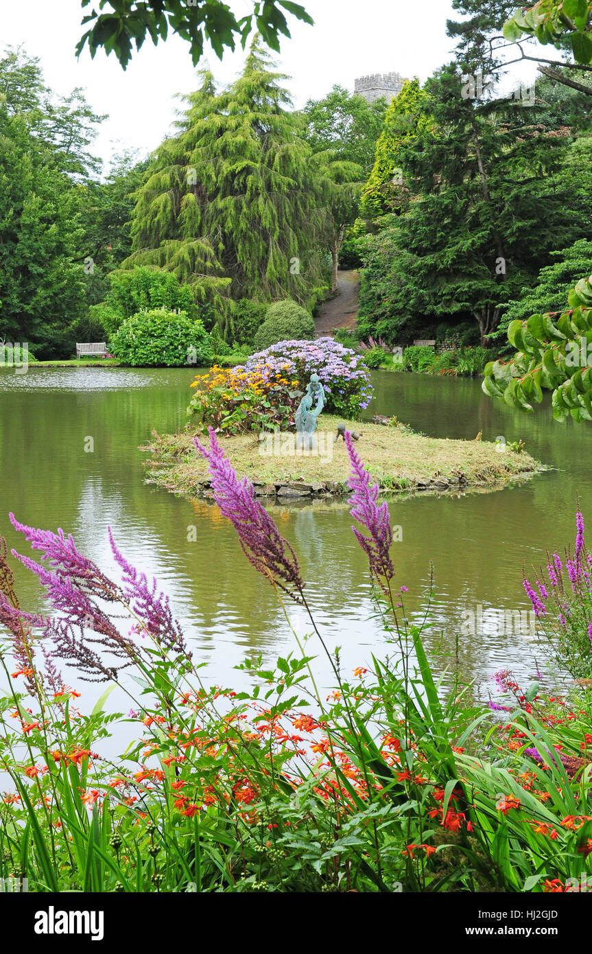 Lake and statues at Marwood Hill Gardens. Stock Photo