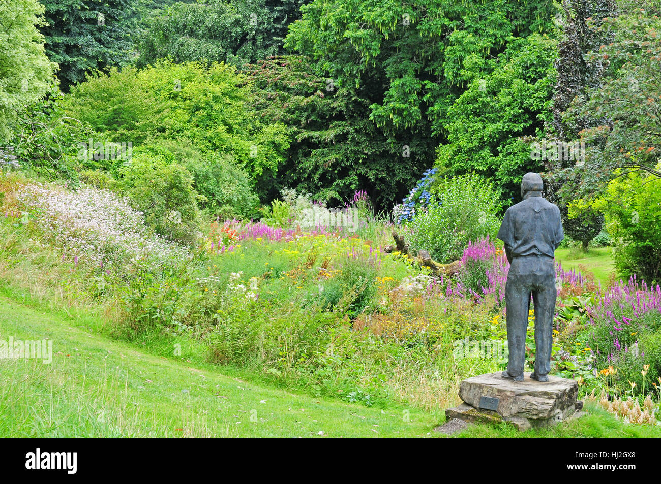 Bronze Statue of Dr Jimmy Smart, who created  Marwood HIll Gardens in 1950s.  Overlooking the bog garden. Stock Photo