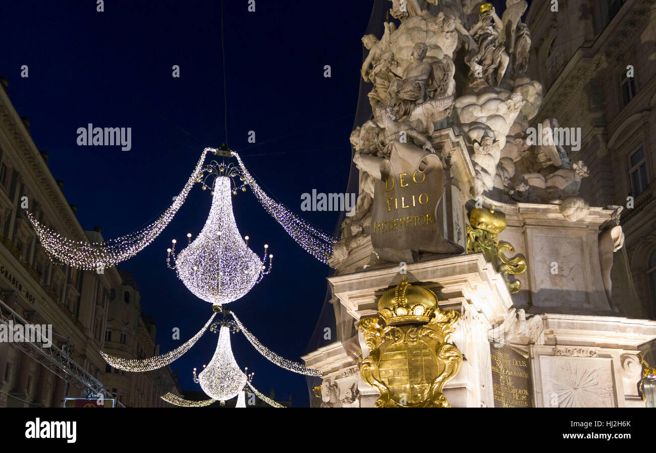 VIENNA, AUSTRIA - JANUARY 1 2016: Night view of Graben street in Vienna during Christmas time, with Pestsaule memorial column in the foreground Stock Photo
