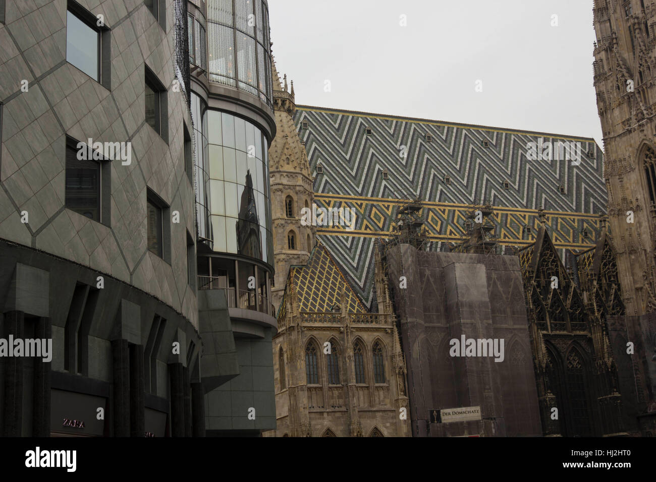 VIENNA, AUSTRIA - JANUARY 3 2016: Architectural close up of Haas Haus building and Stephansdom cathedral in Vienna, detail with no people Stock Photo