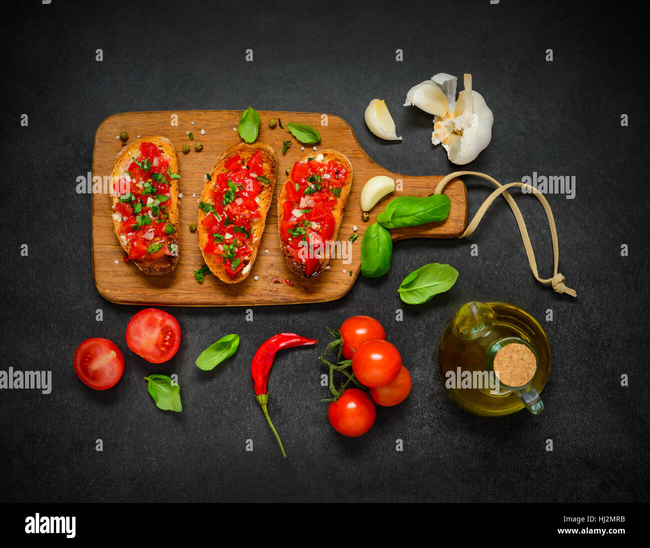 Bruschetta with Fresh Tomato and Basil. Vegetables with Olive Oil Stock Photo
