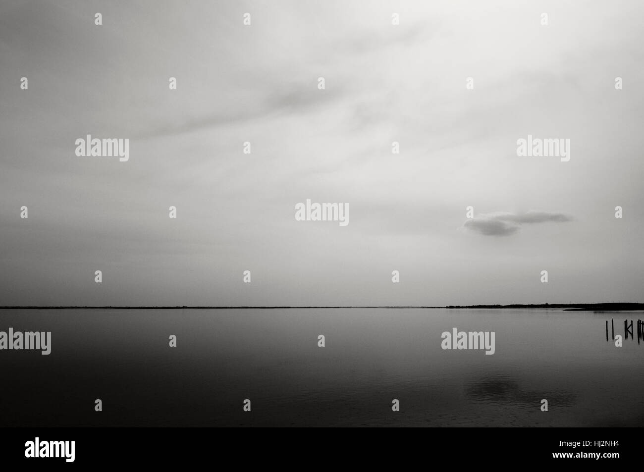A calm evening on a bay shown in black and white Stock Photo - Alamy