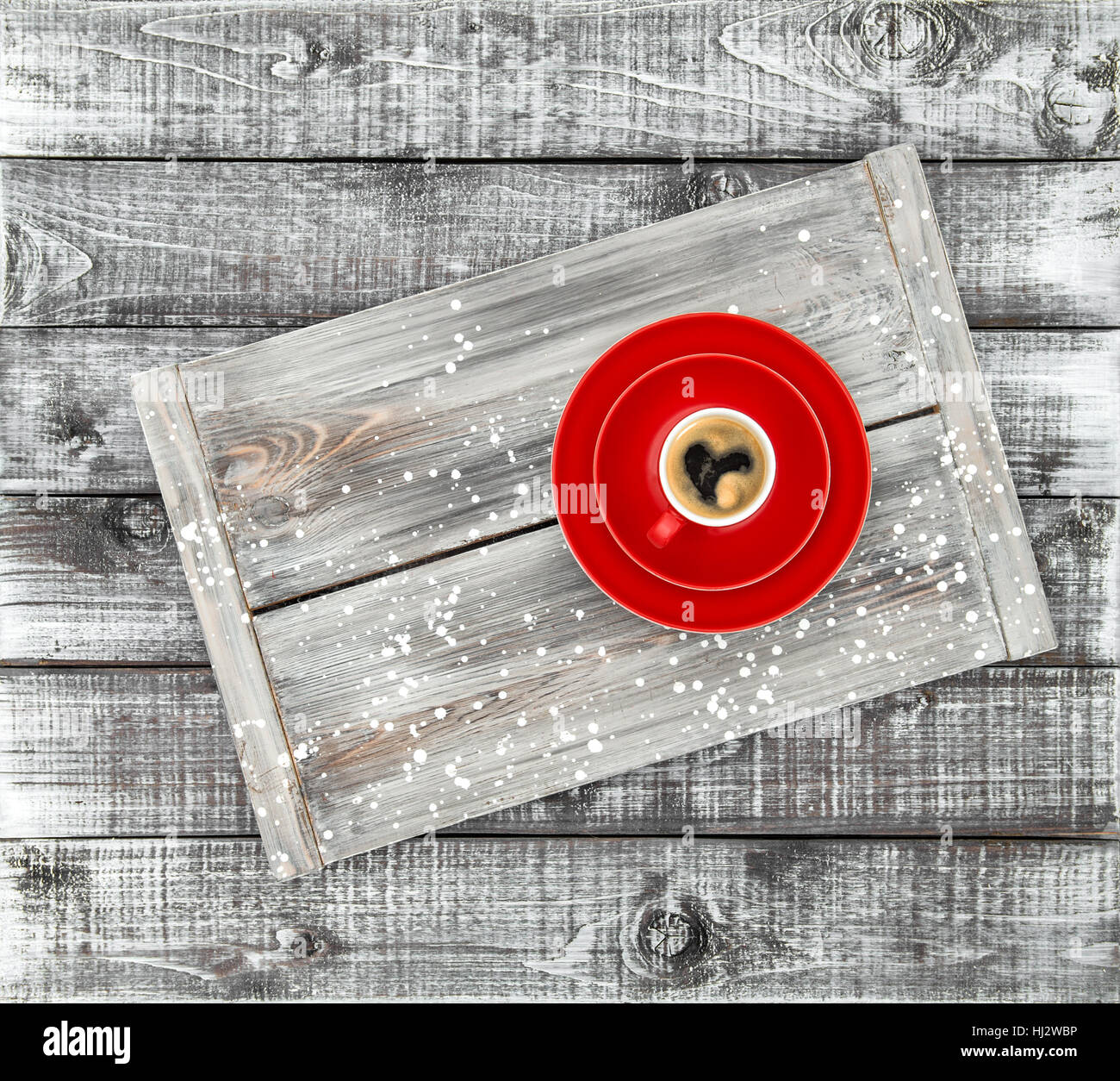 Black coffee with heart in red cup on wooden background. Valentines day ...