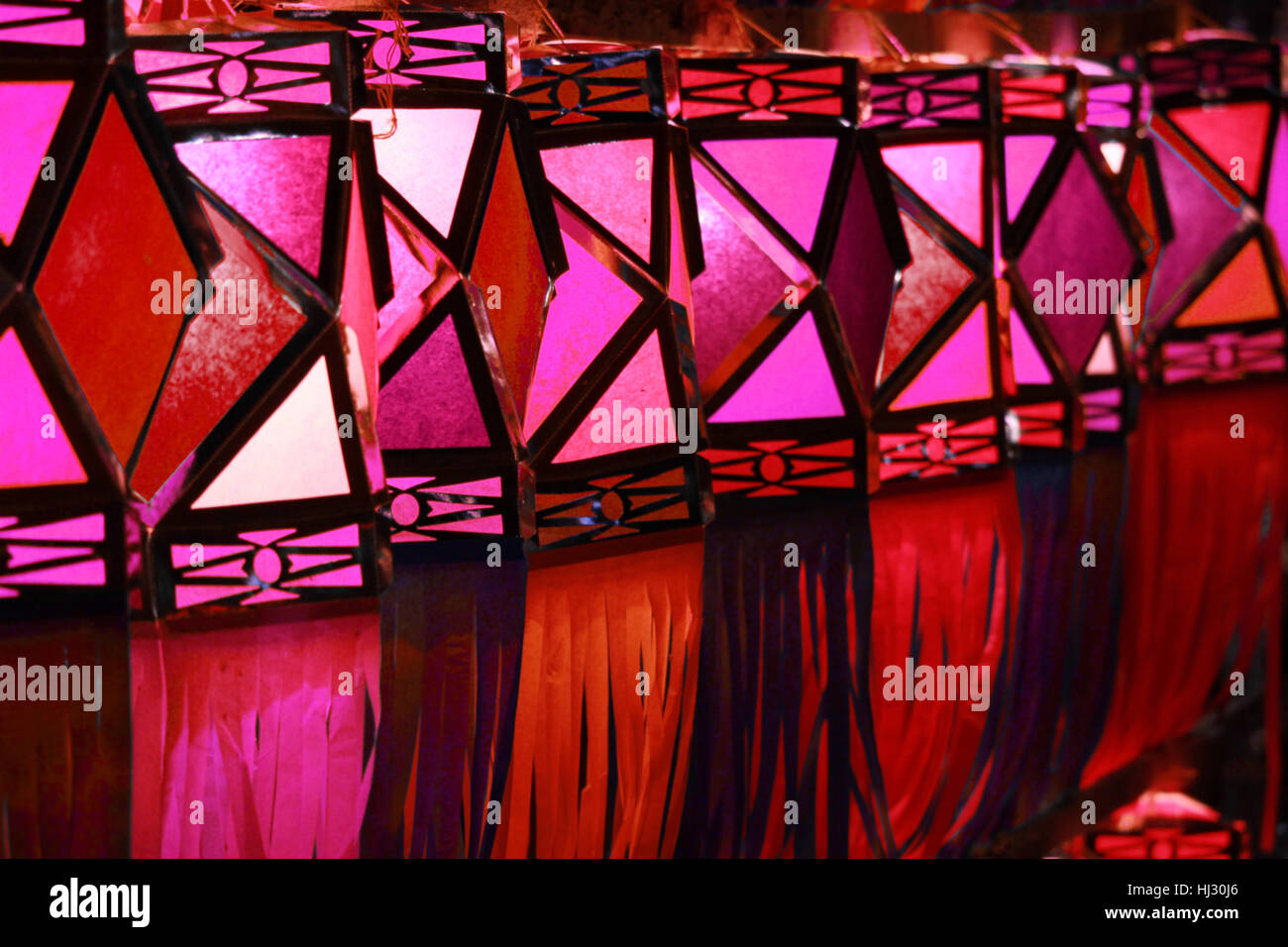 A line of traditional handmade Diwali lanters in red color used for decoration in the hindu festival in India. Stock Photo