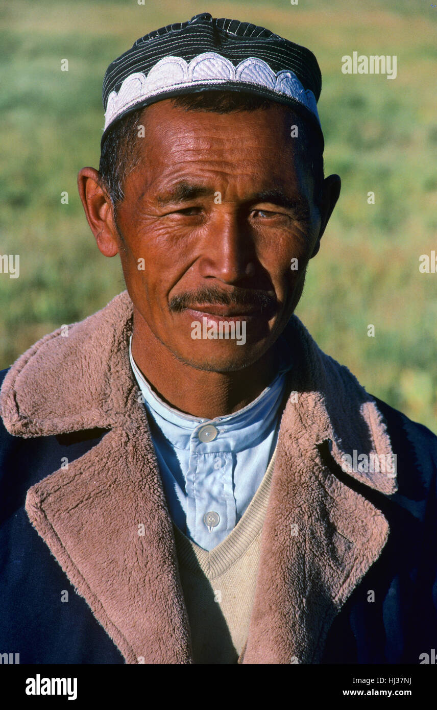 Portrait of Kyrgyz or Kirghiz Man or Herdsman Wearing traditional Kirghiz Hat  and Costume or Clothing Kyrgyzstan or Kyrgyz Republic Stock Photo