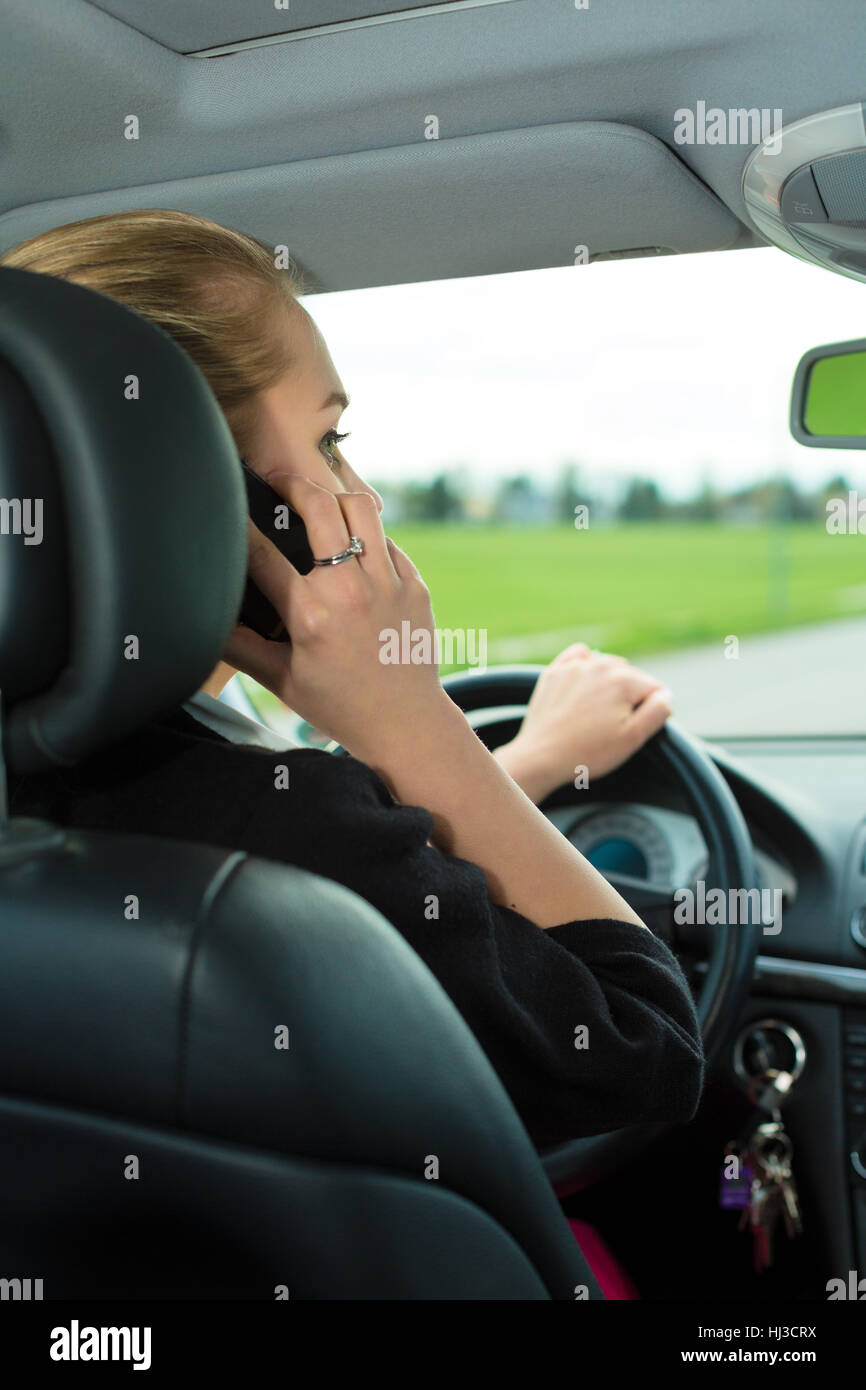 Woman speaking mobile phone rear view hi-res stock photography and ...