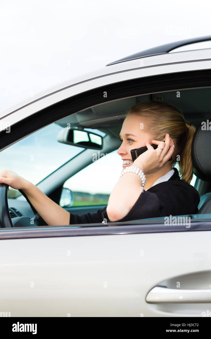 Woman speaking mobile phone rear view hi-res stock photography and ...
