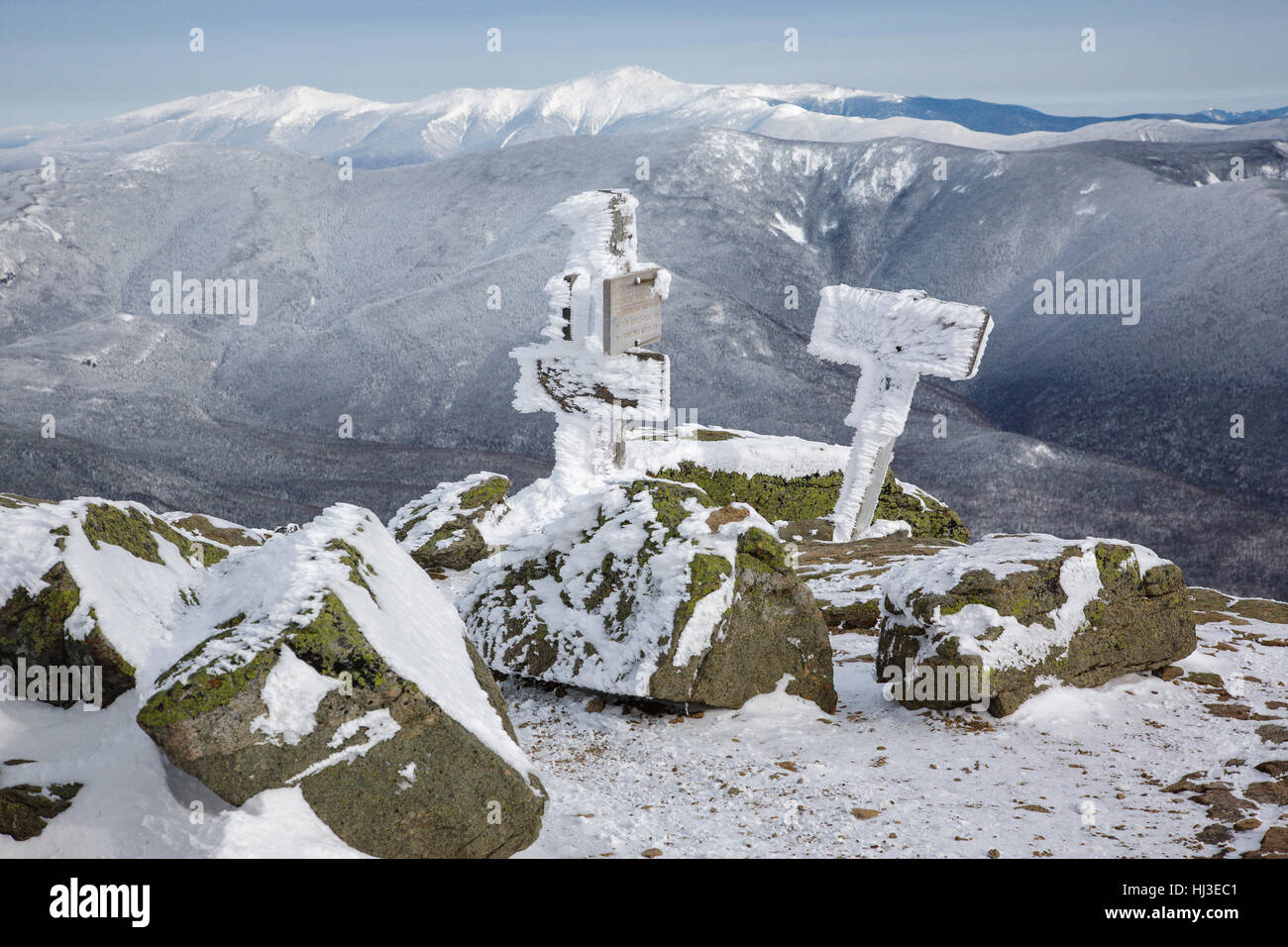 Trail signs on the summit of Mount Lafayette covered in snow during the