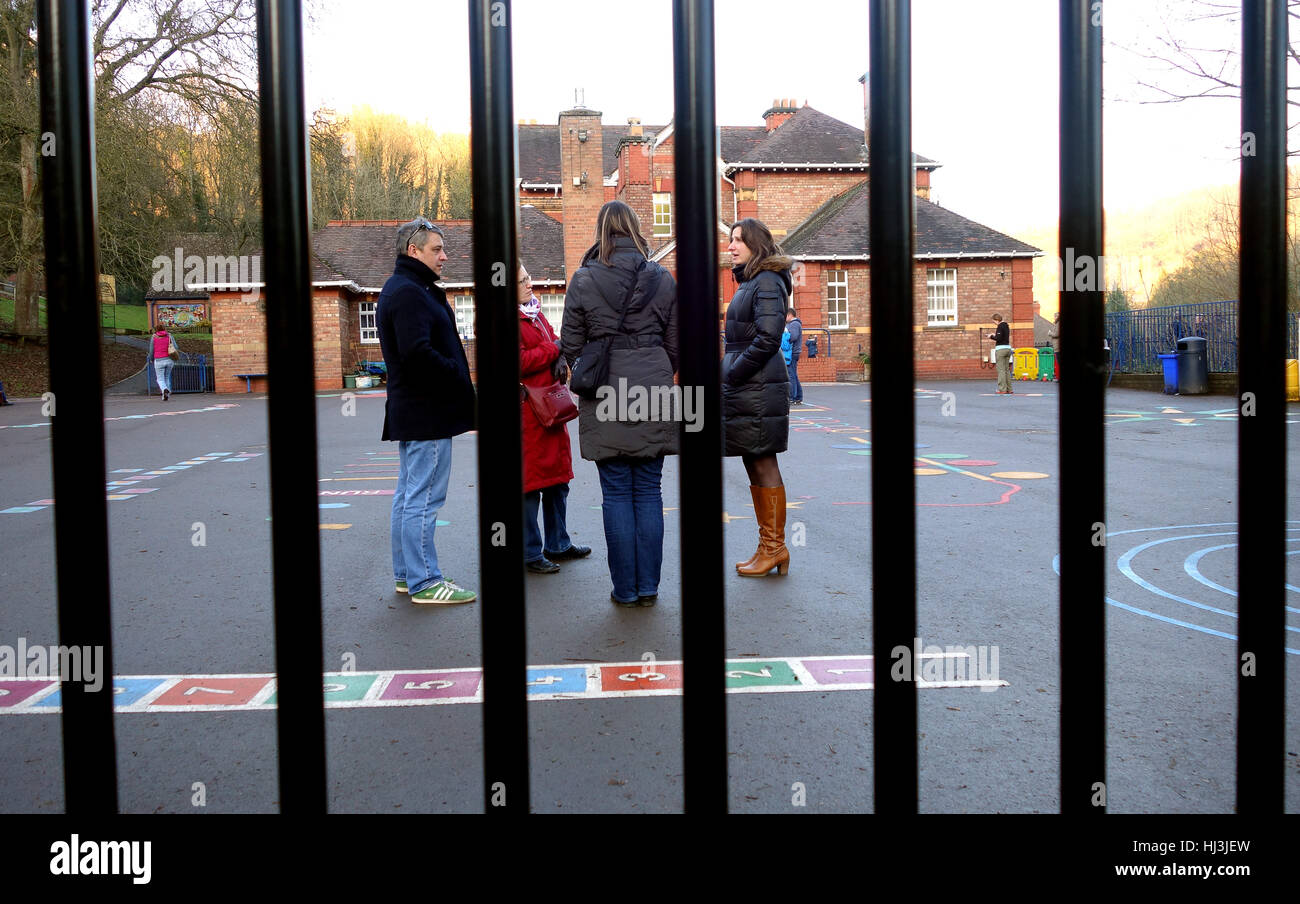 Parents waiting at the school gates to collect children Stock Photo Alamy