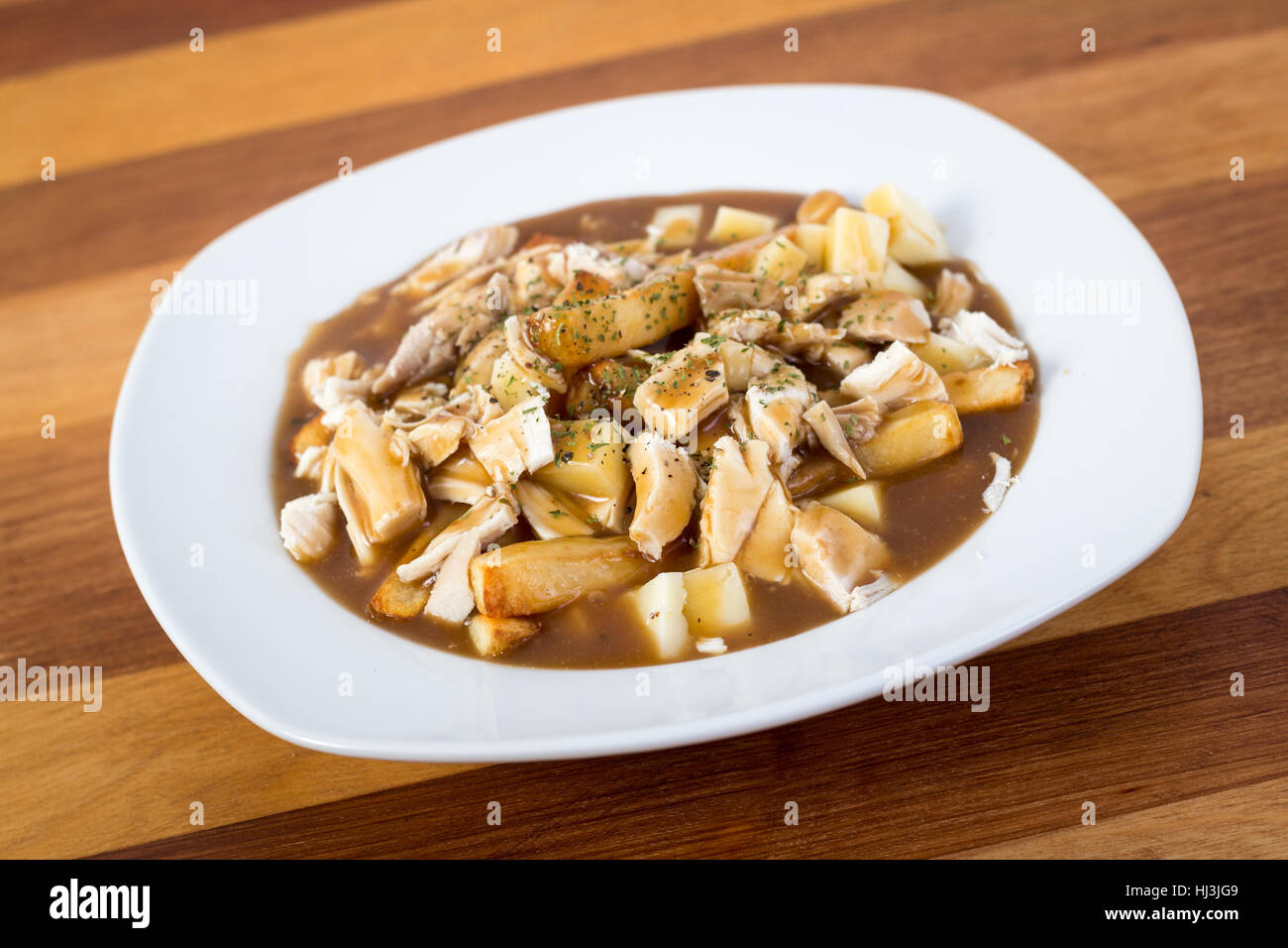 chicken poutine quebec cuisine made with gravy fried cheese curd and chicken Stock Photo