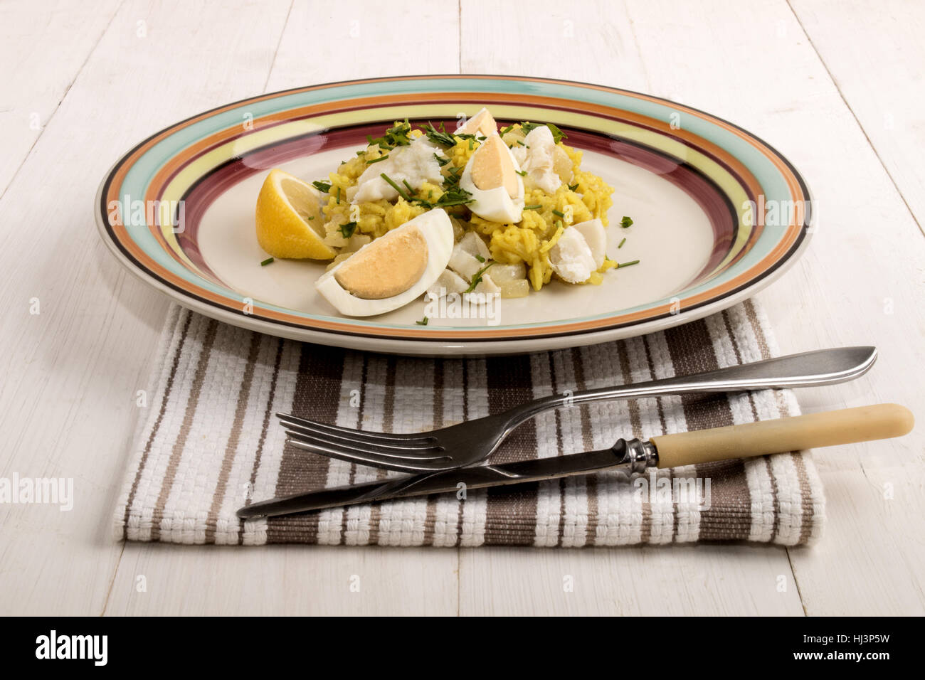 scottish dish kedgeree with roasted basmati rice, cooked haddock and