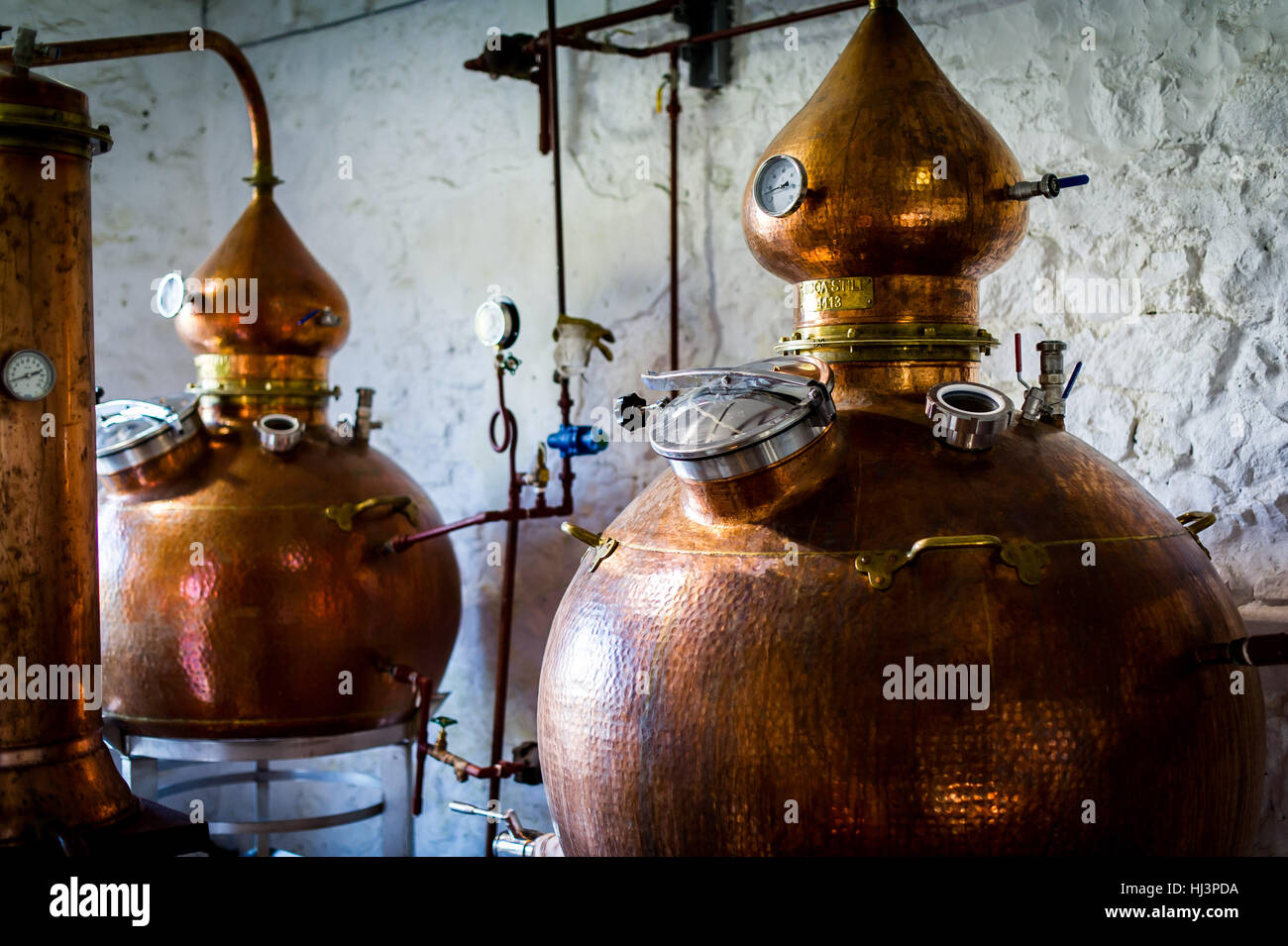 Various stages of gin distillation in Scotland. Stock Photo