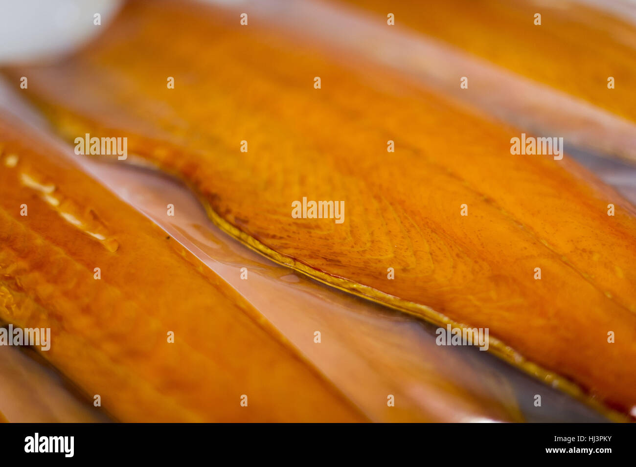 Preparation process of Scottish Smoked Salmon for retail in shops and stores. Stock Photo