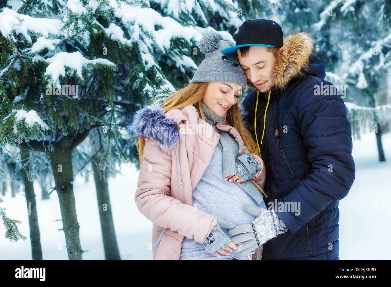Man holding pregnant belly Stock Photo - Alamy