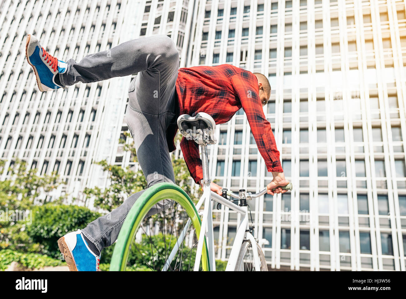 Handsome young man on bike in the city. Bicycle concept Stock Photo