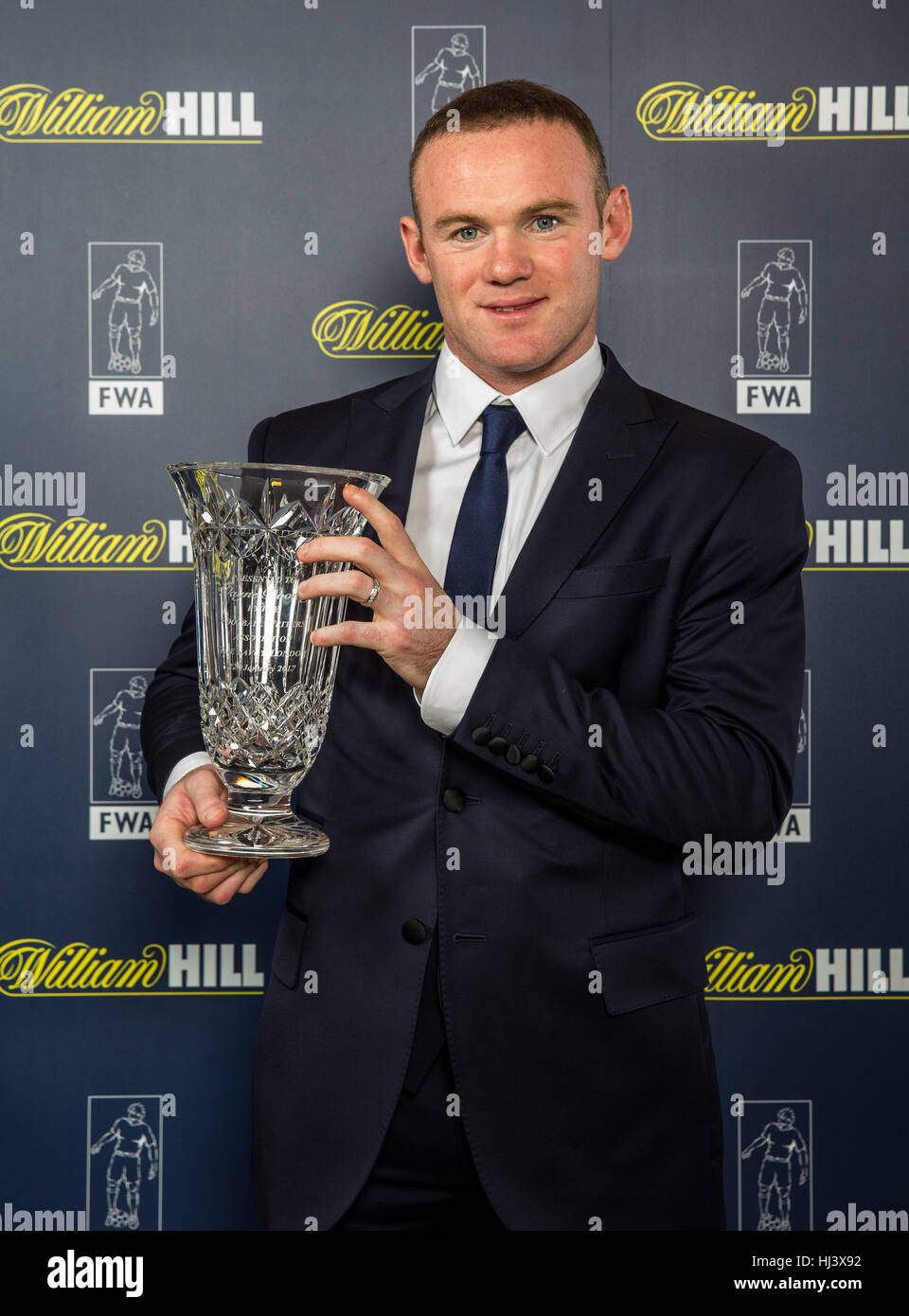 Manchester United Wayne Rooney pose with his awards from Football Writers Association during an FWA Gala Dinner at The Savoy, London. Stock Photo