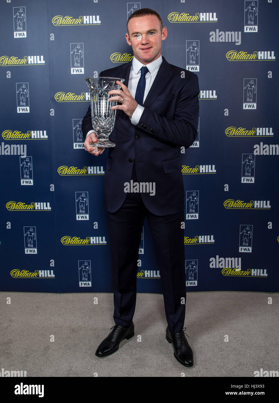 Manchester United's Wayne Rooney pose with his awards from Football Writers Association during an FWA Gala Dinner at The Savoy, London. Stock Photo