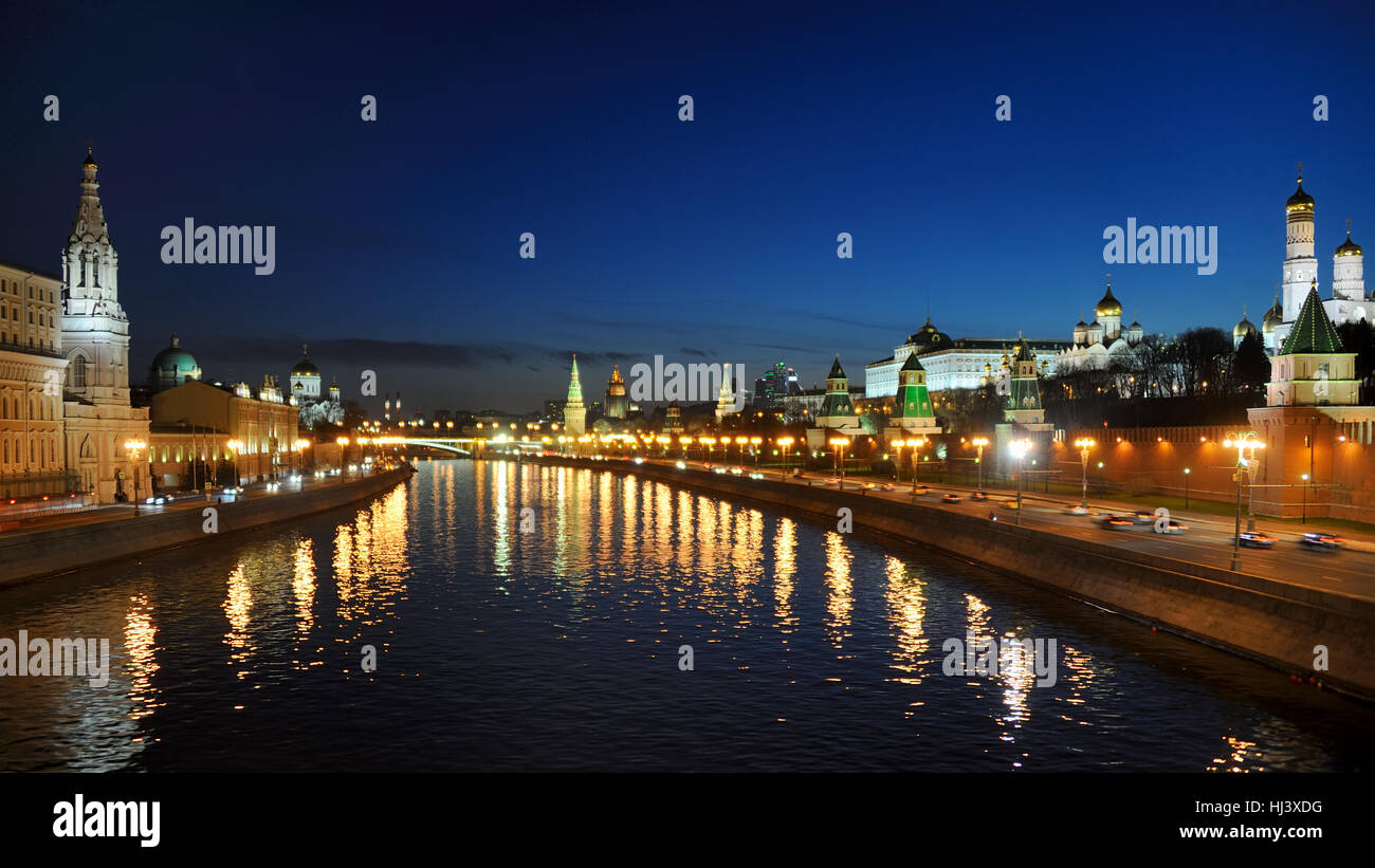 Twilight over the City of Moscow. The view from Bolshoi Moskvoretsky Bridge on Moskva River, Sofiyskaya and Kremlin Embankments Stock Photo