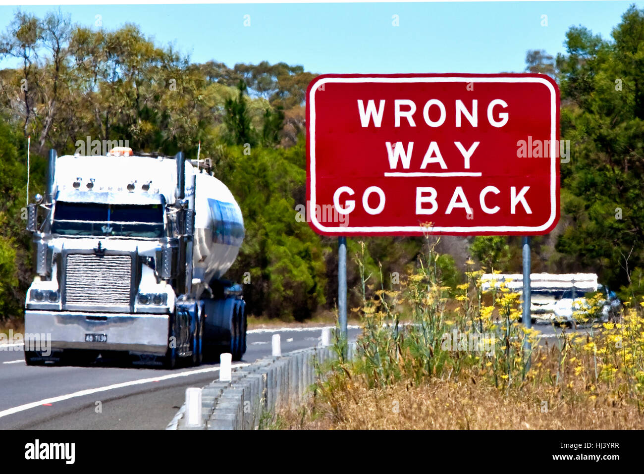Road sign warning - Wrong way go back on Hume Highway in Australia Stock Photo