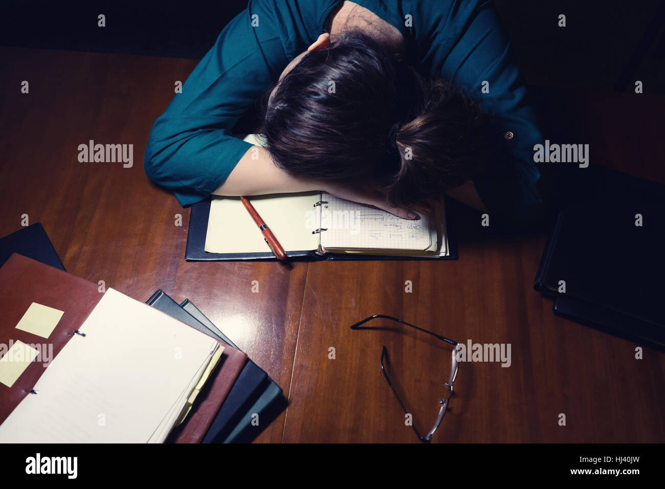 Tired young lady sleeping on her books Stock Photo - Alamy
