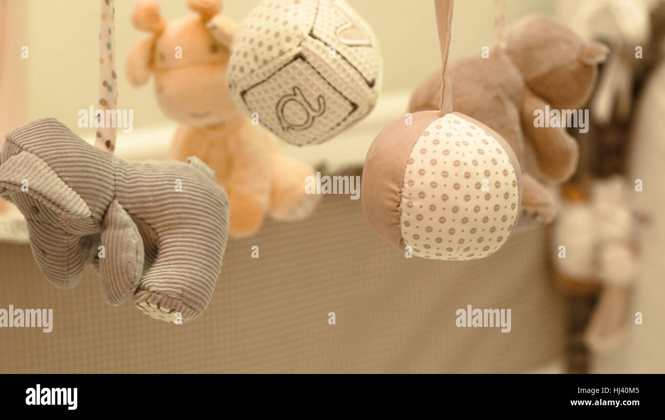 Children's mobility hanging toy in the crib Stock Photo Alamy