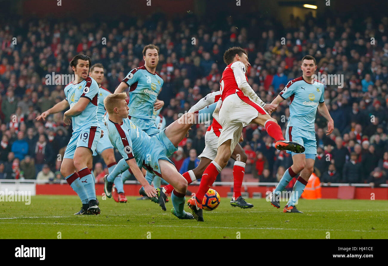 Ben Mee of Burnley fouls Arsenal’s Laurent Koscielny for a penalty in added time during the Premier League match between Arsenal and Burnley at the Emirates Stadium in London. January 22, 2017.  EDITORIAL USE ONLY Stock Photo