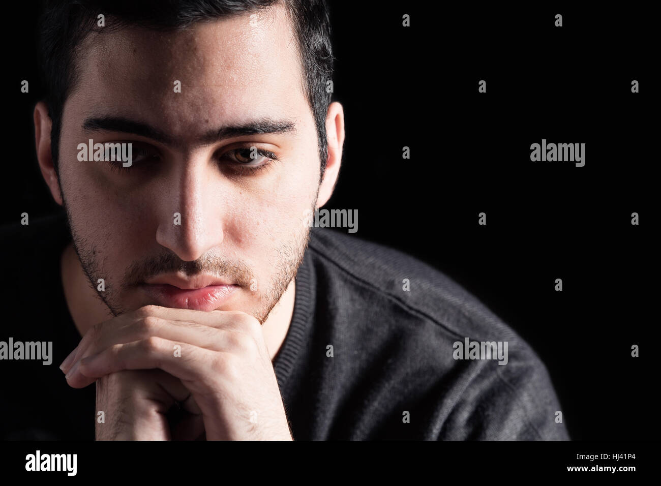 Young Man on Black Background Stock Photo