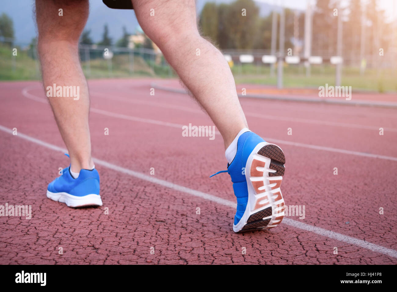 Runner legs close up on the race track Stock Photo Alamy