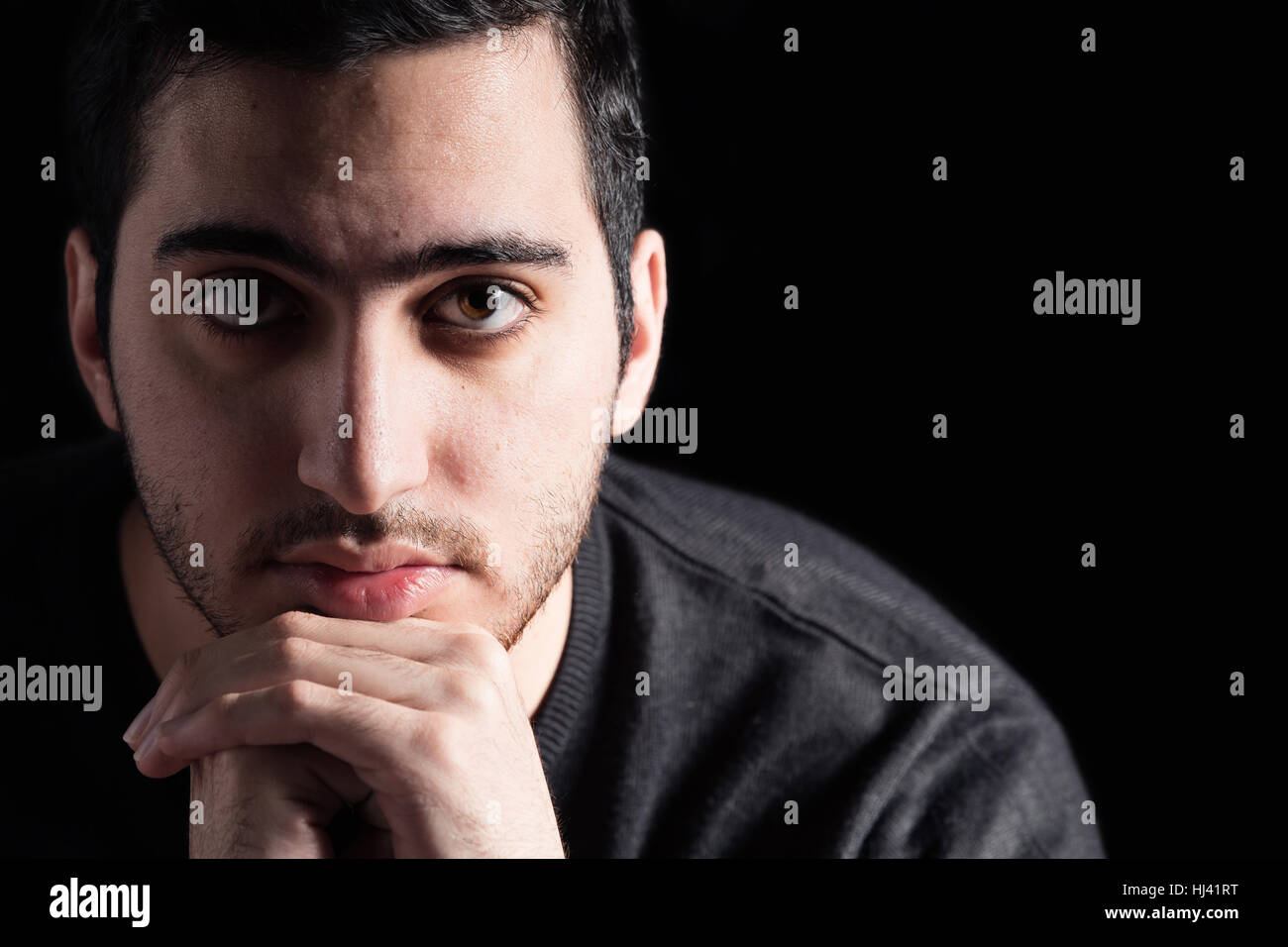 Young Man on Black Background Stock Photo