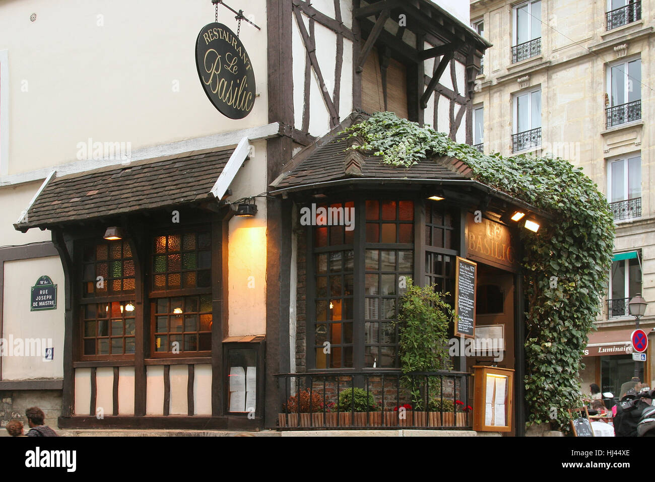 French restaurant Le Basilic in Rue Joseph de Maistre, Paris, France Stock Photo