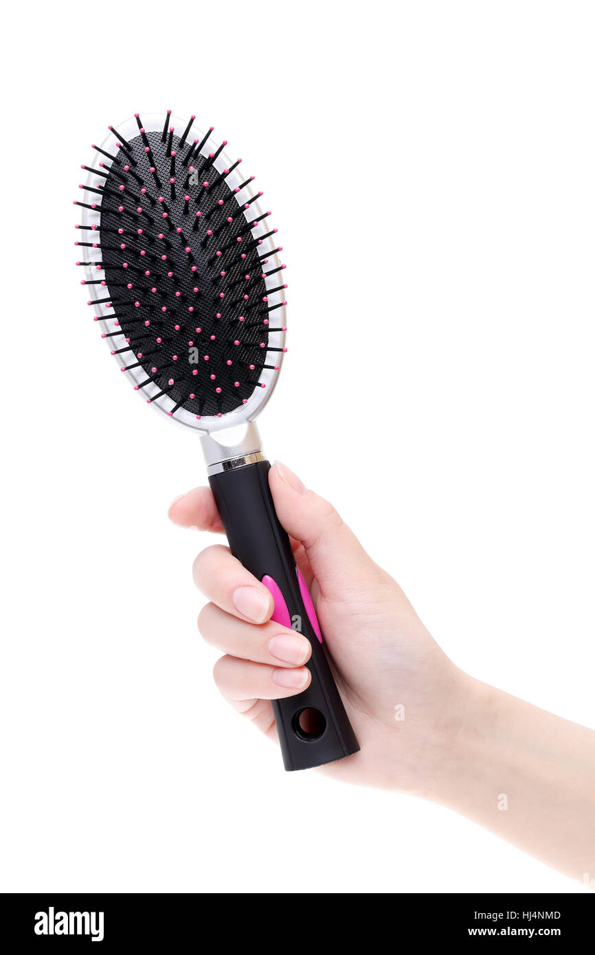 Hand holding plastic hairbrush isolated on white background Stock Photo