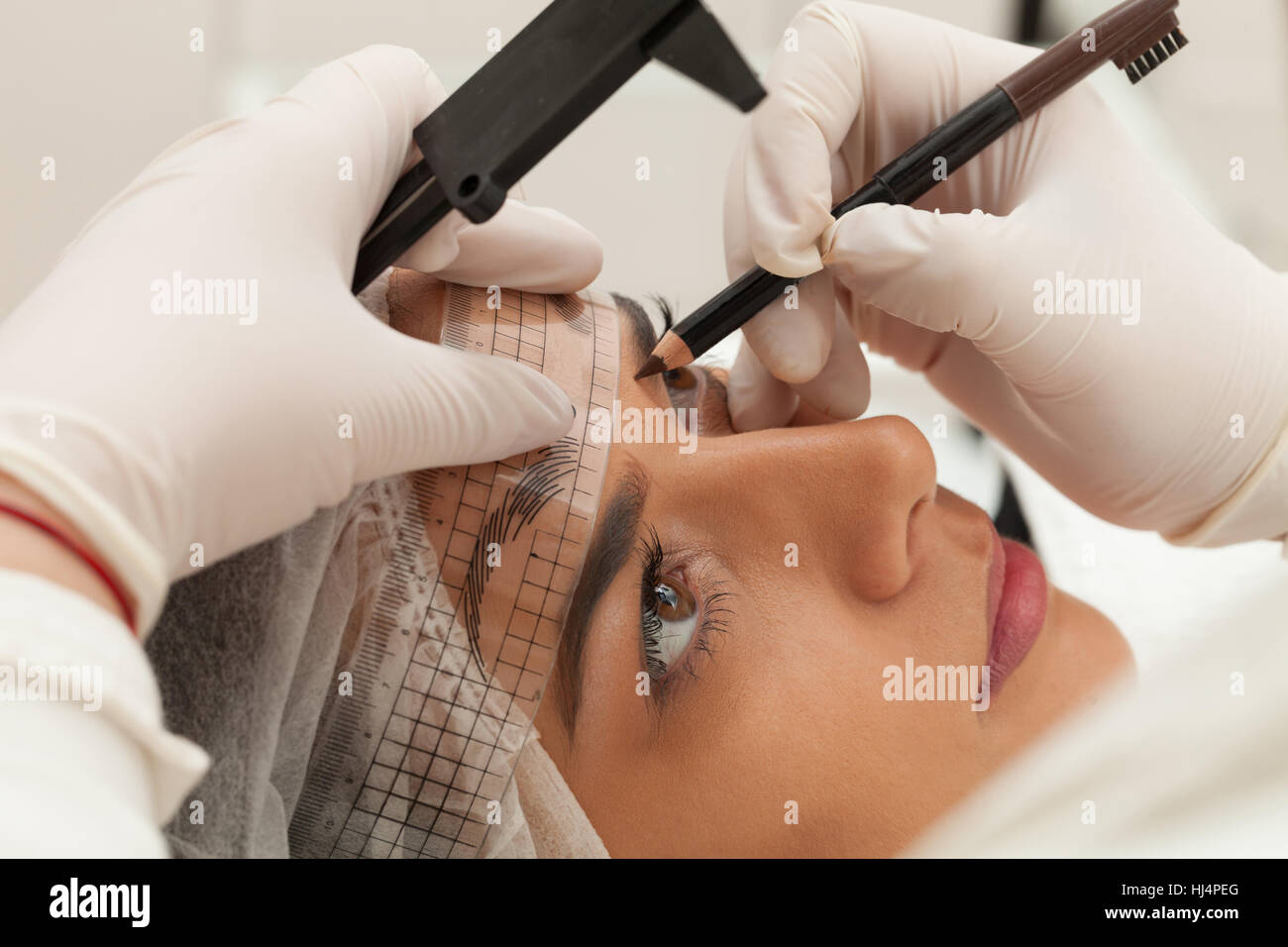 Permanent make up eyebrows in beauty salon Stock Photo