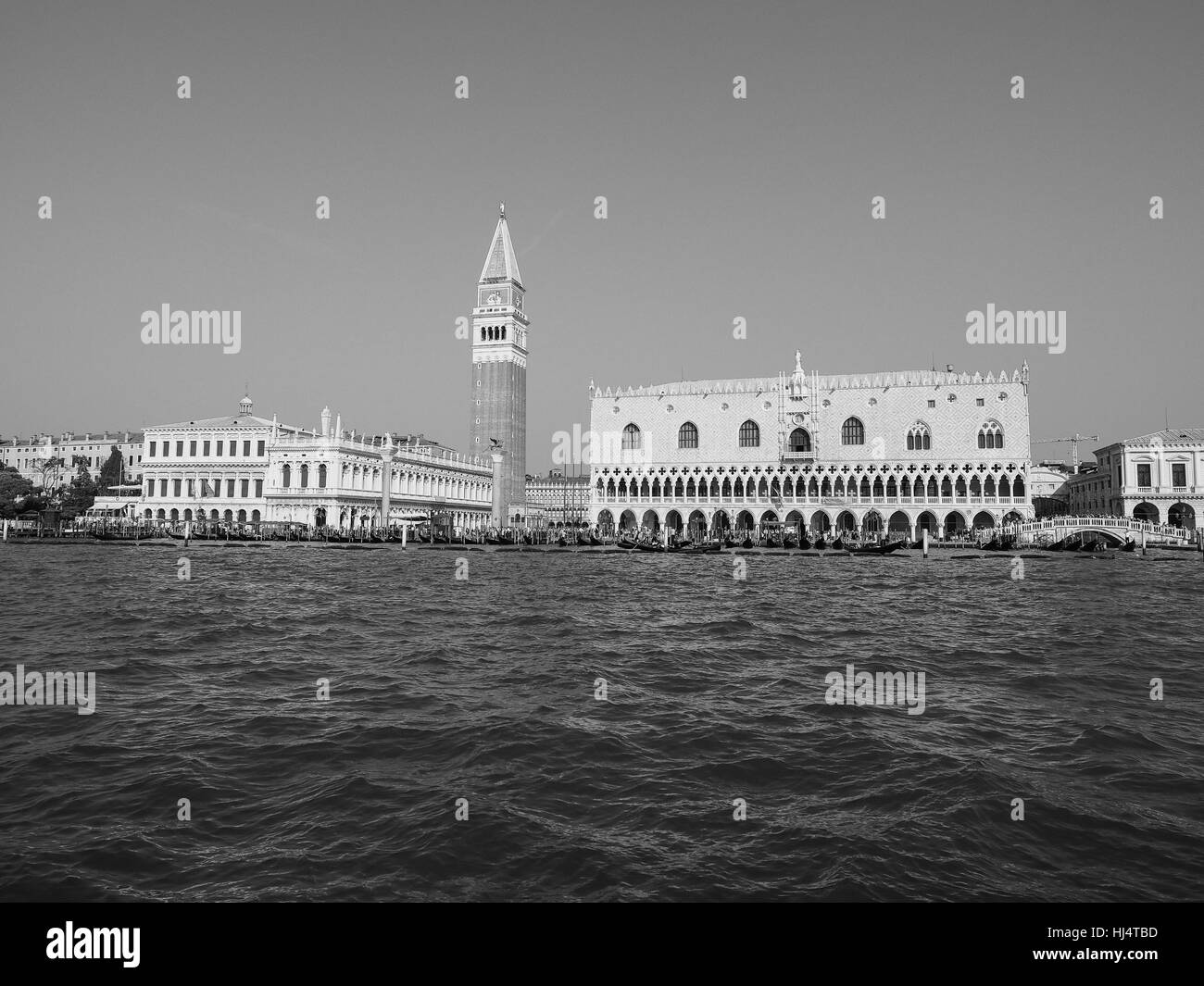 Piazza San Marco (meaning St Mark square) seen from San Marco basin in Venice, Italy in black and white Stock Photo