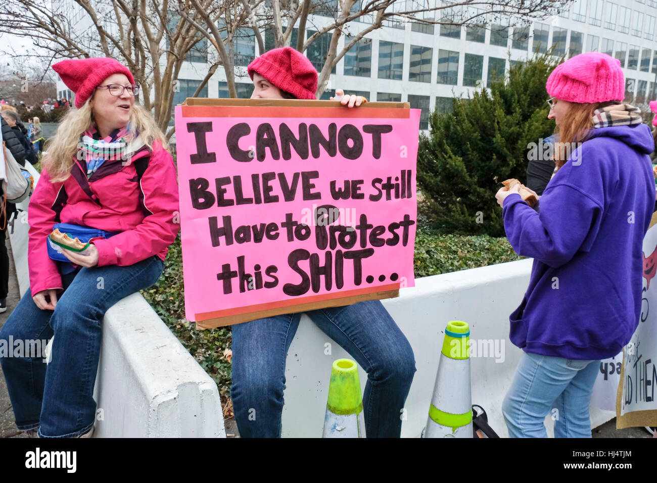 Protesters wearing pink hats and pink or purple jackets at Women's March on Washington DC January 21 2017 Stock Photo